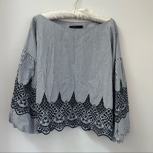 BCBG striped cropped blouse with navy doily detailing.